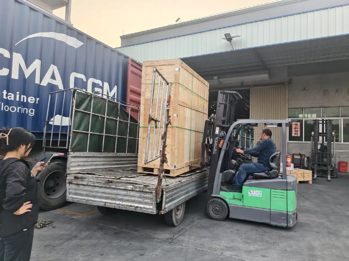 A single crated machine being loaded into a shipping container